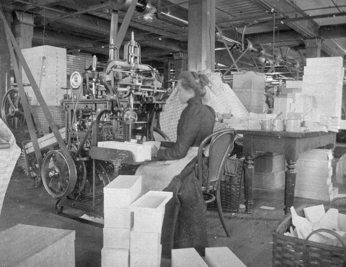 Woman working the area where they make envelopes at the J.C. Blair Company